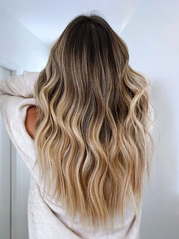 Long, dimensional blonde balayage — hand-painted lived-in color, back view